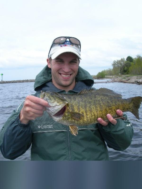 Andy Miller holding a smallmouth bass