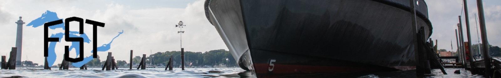 FST logo over Gibraltar Island dock