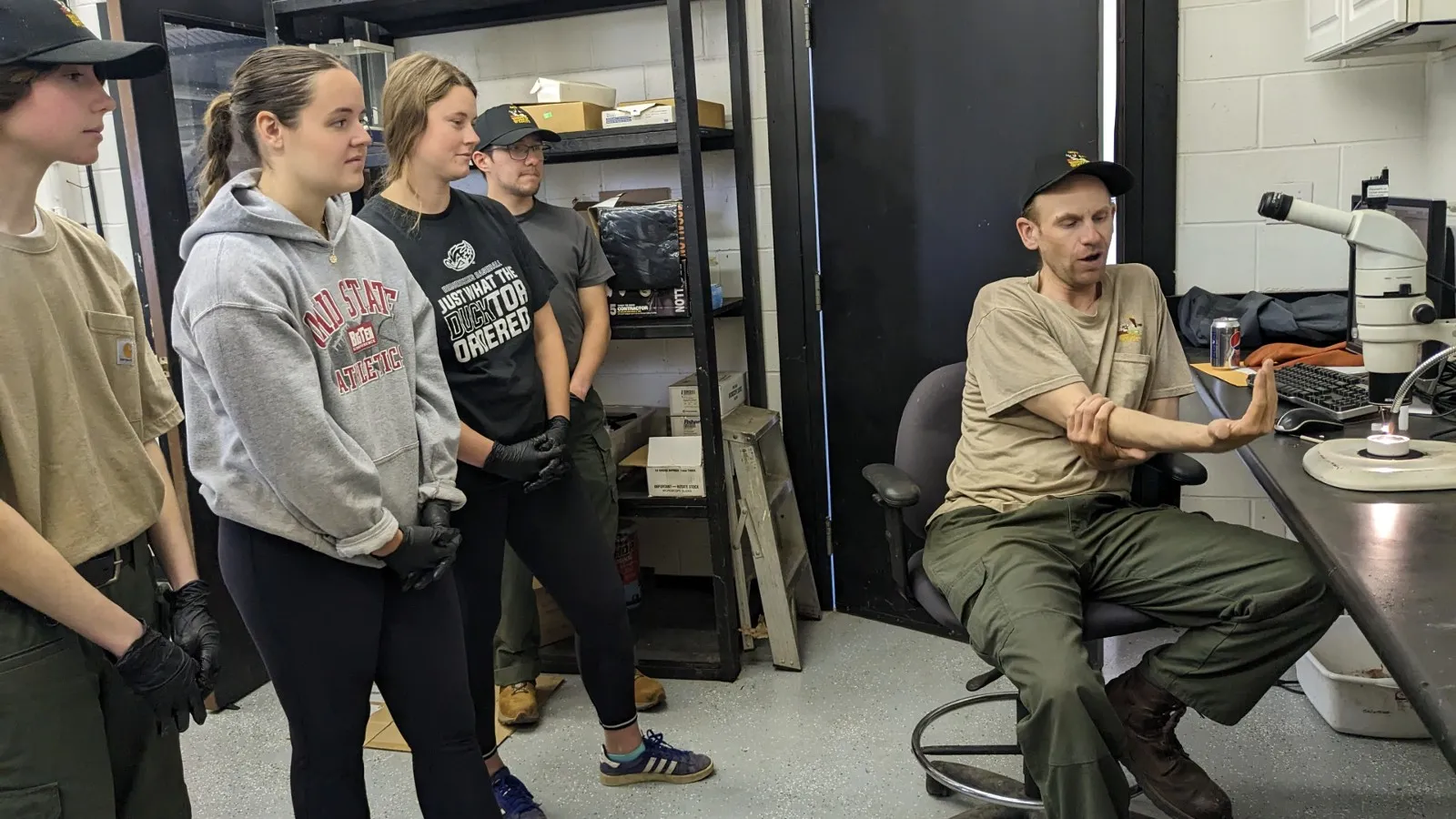 REU students listening to Steve teach about otolith aging