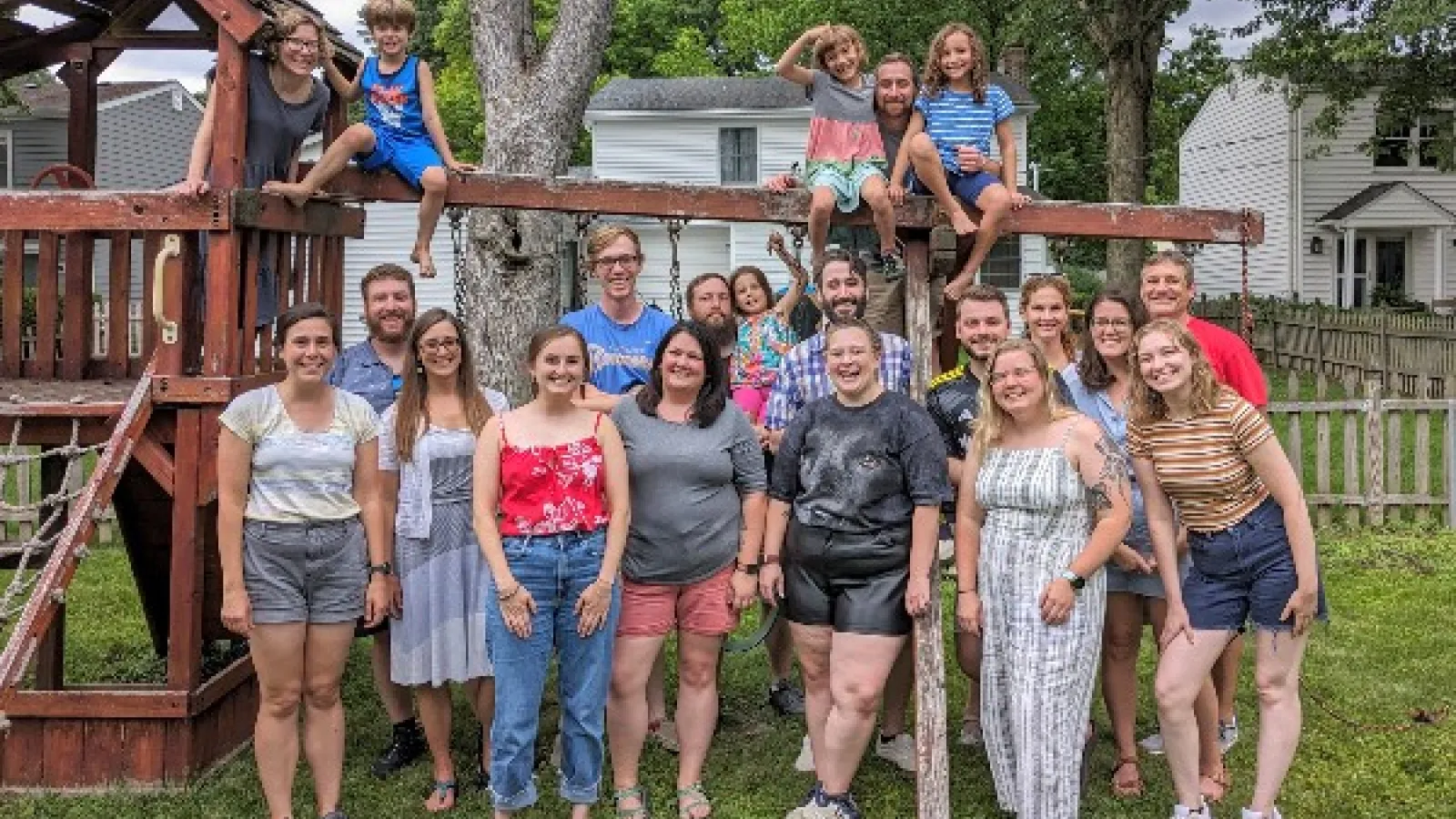 Group Photo of AEL members on a backyard swing set