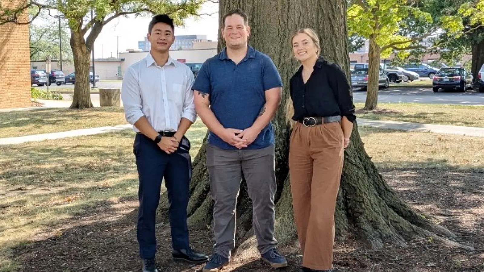 Hwan Chen, Mike Figueroa, and Kendall Ashley in front of a tree