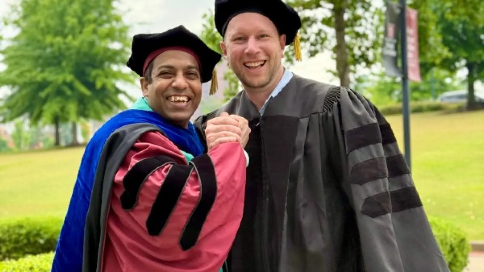 Nayan Mallick and Josh Stone in academic regalia