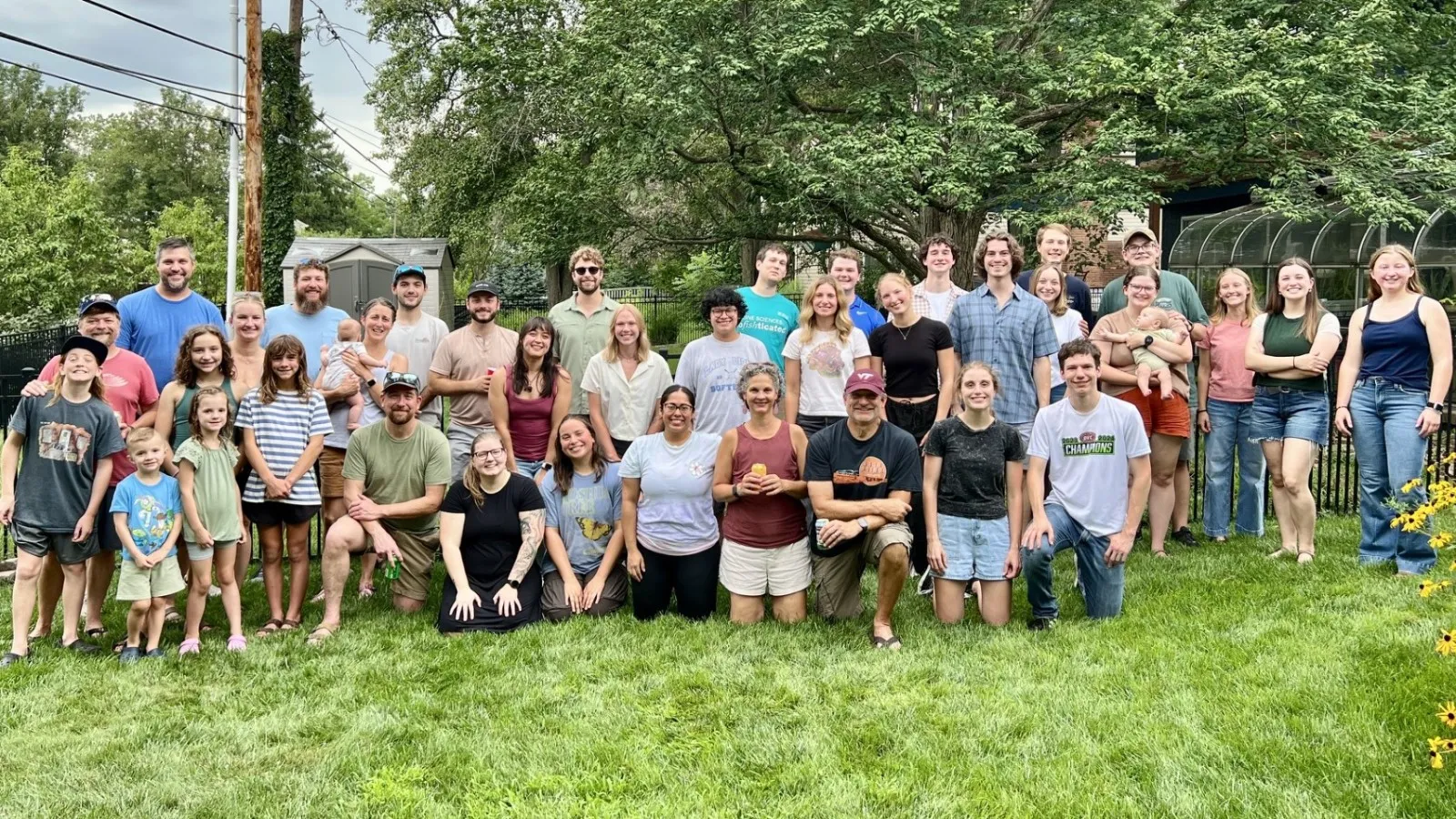 Group of AELers in the backyard at the Pig Roast