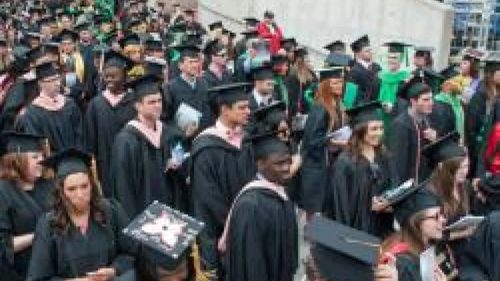 Generic photo of OSU grads at graduation in cap & gowns