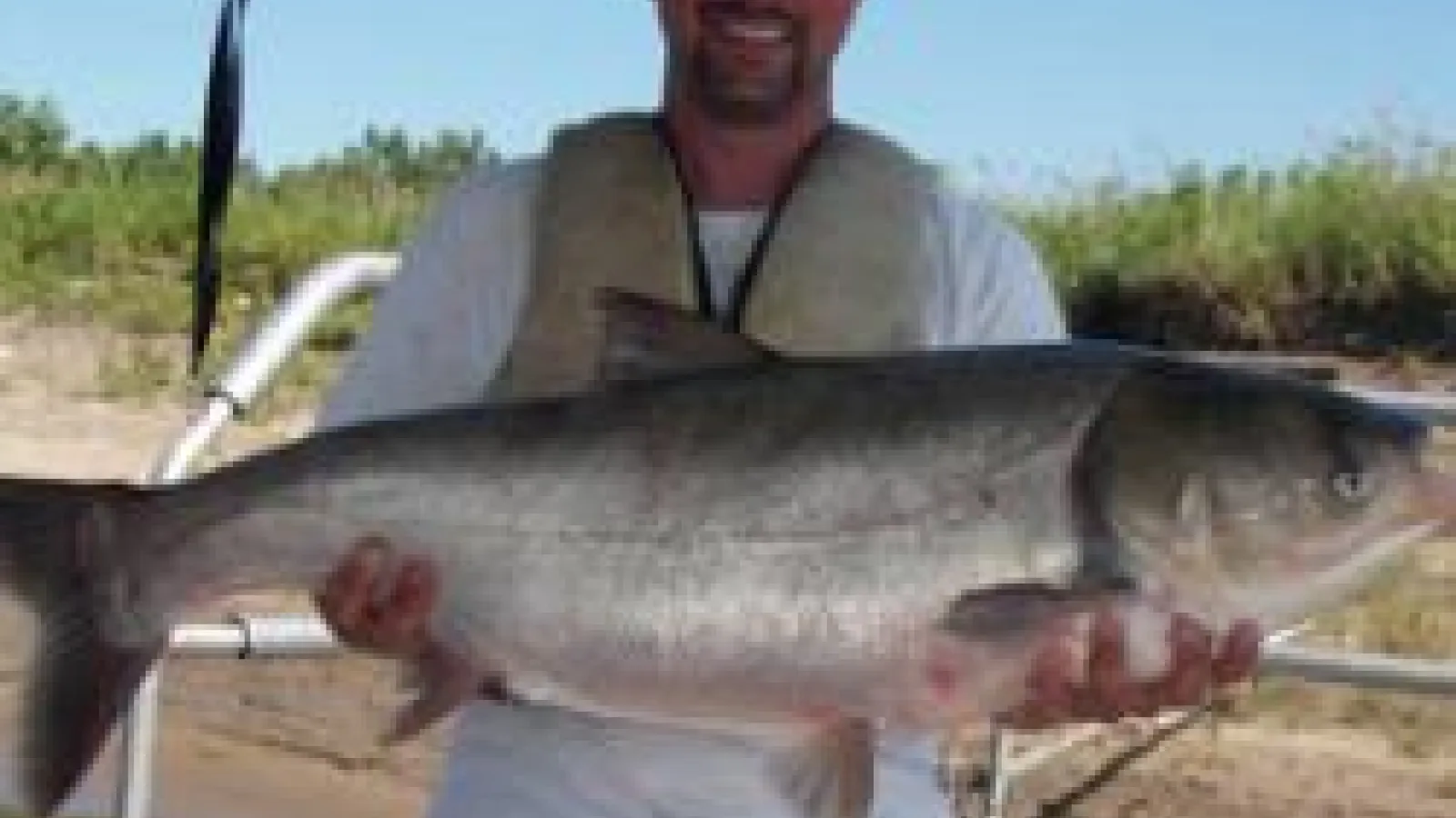 Dave Glover holding a large Asian Carp