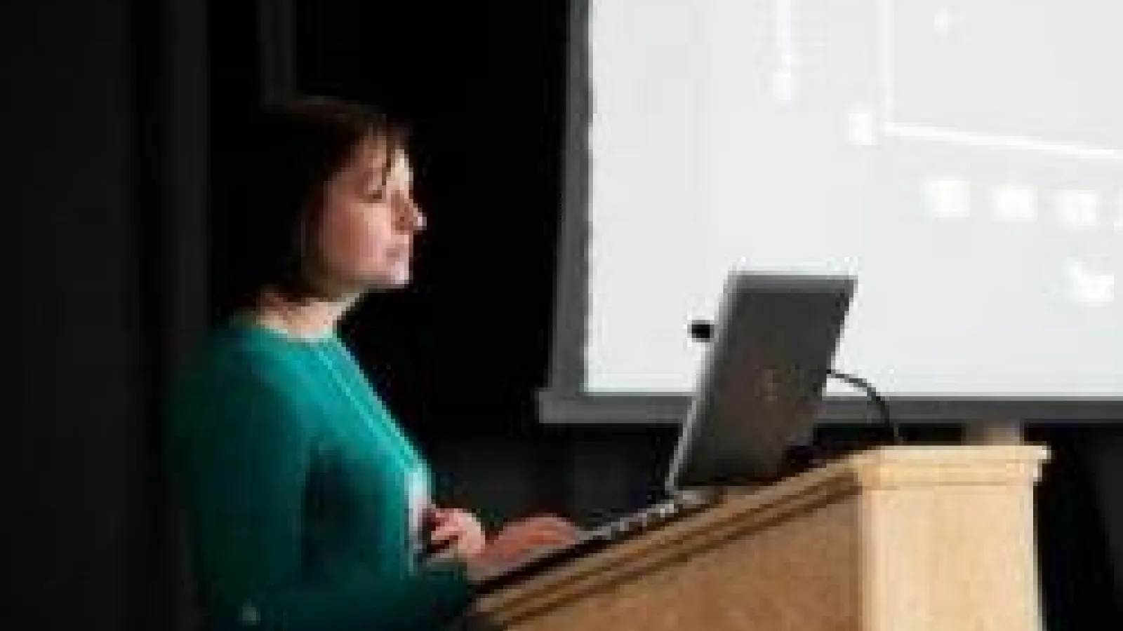 Ruth Briland presenting at a podium