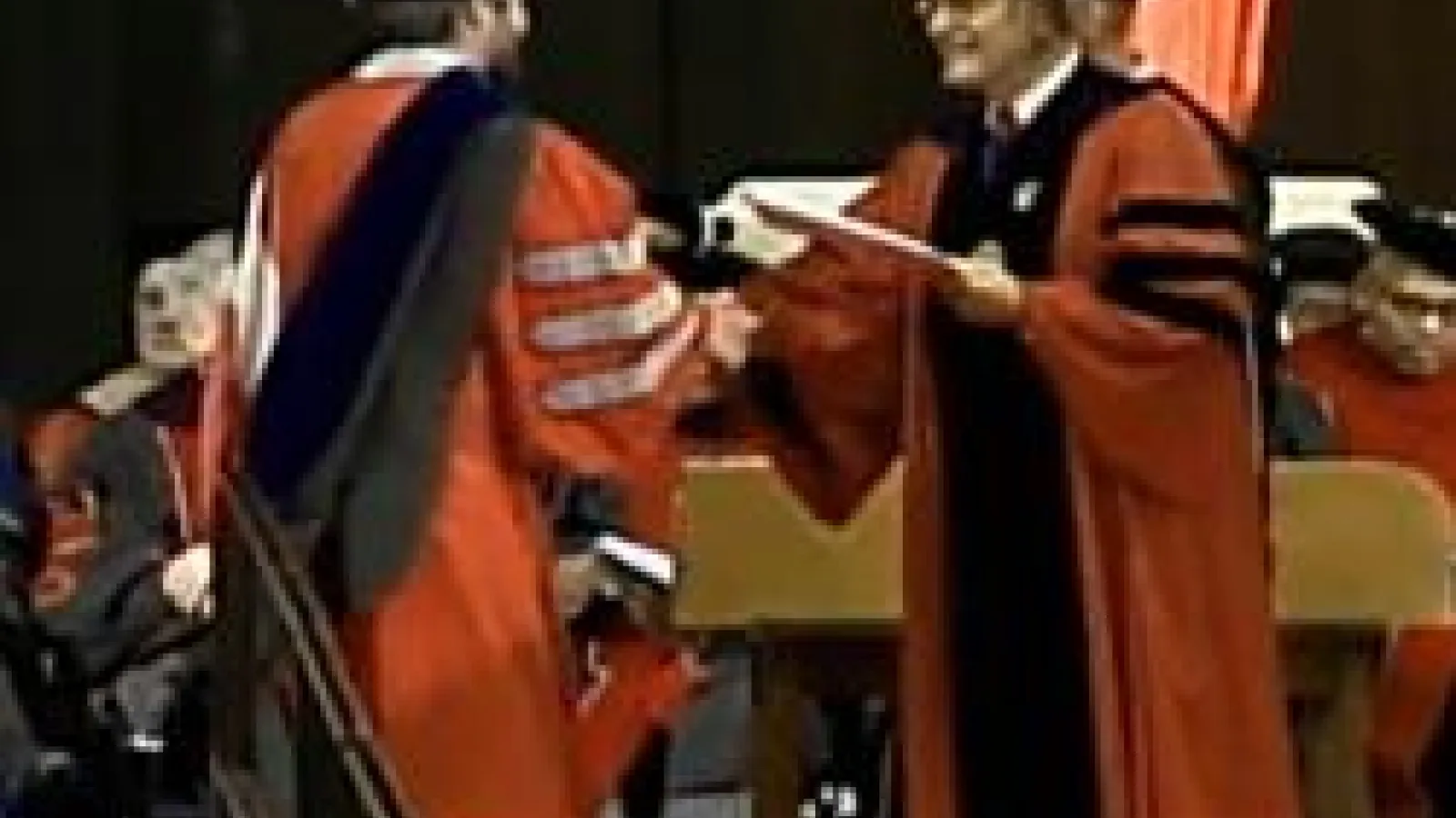 Troy Farmer receiving his diploma at graduation