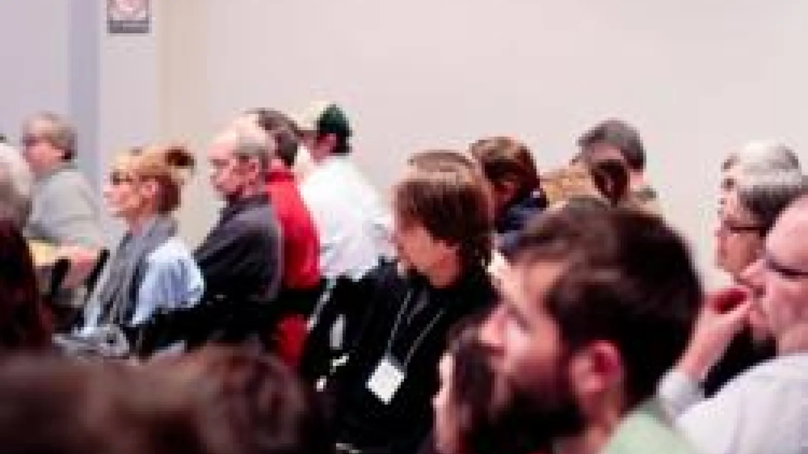 Group of people listening at Research Review