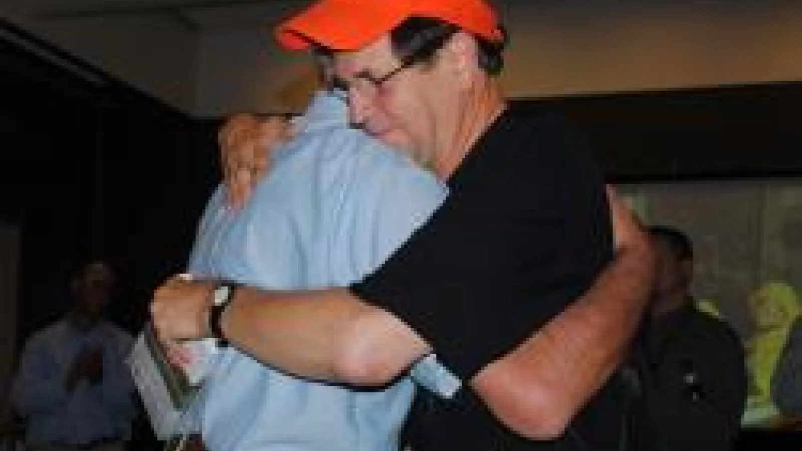 Roy Stein hugging a colleague