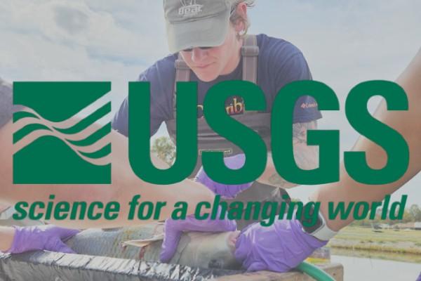 USGS Logo over James Dowling doing fish surgery