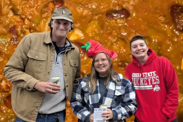 Sawyer Olson, Kylee Wilson, and Madeline Schumacher; background is chili