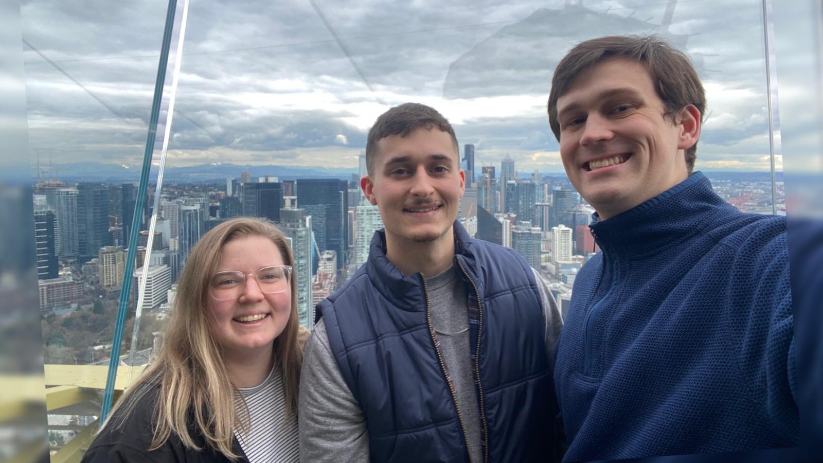 Kylee Wilson, Jarrod Ludwig, and Andrew Foley on the space needle viewing platform
