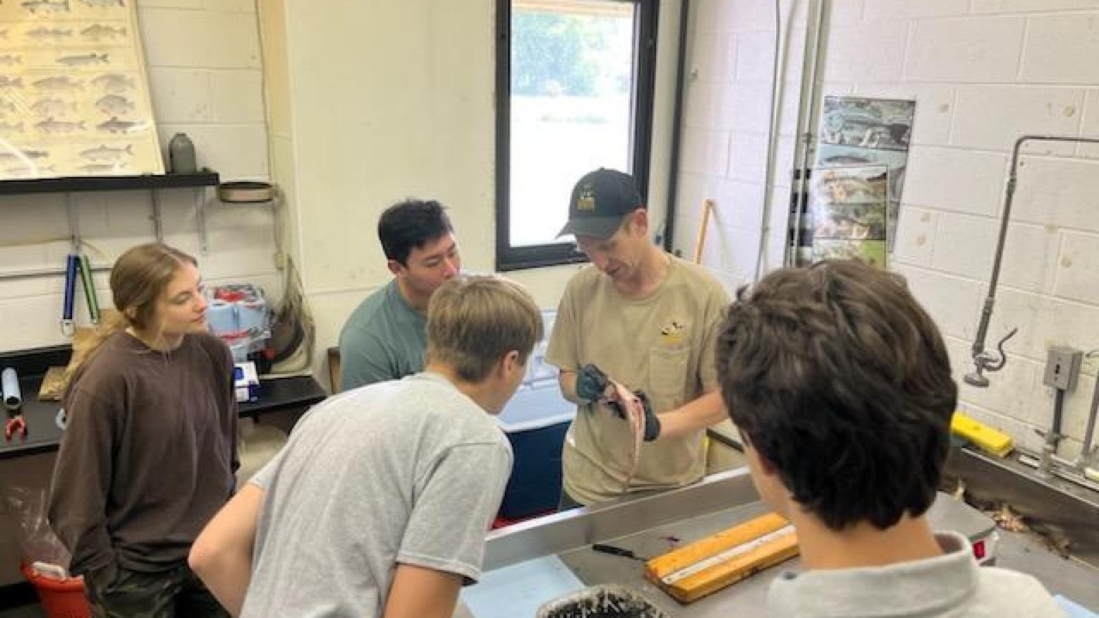 REU students and DOW staff participating in a dissection demonstration