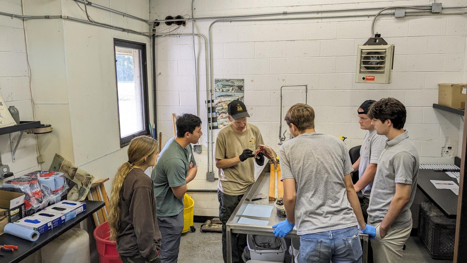 REU students and DOW staff participating in a dissection demonstration