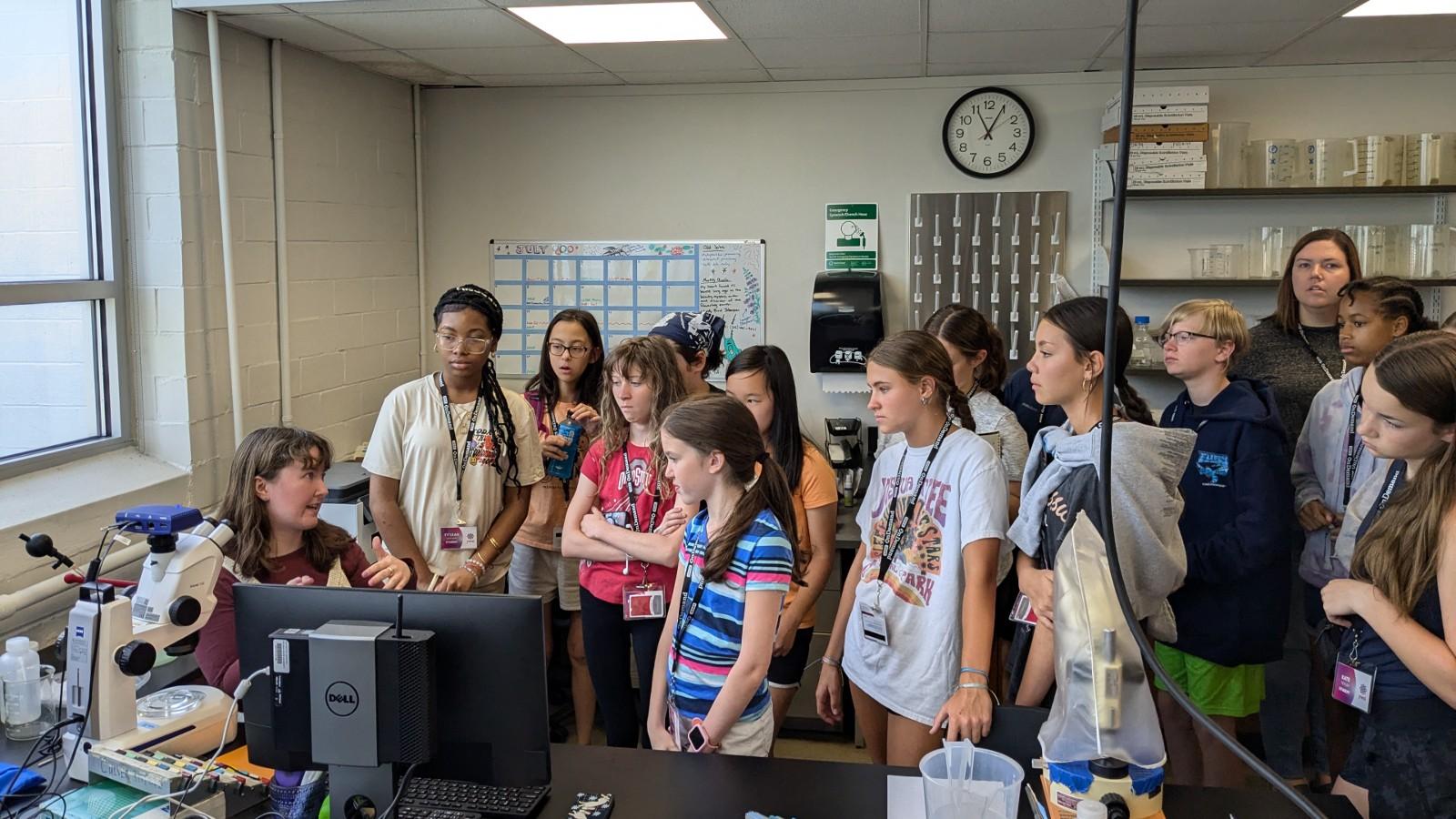 Megan Garvey showing the students zooplankton magnified on her computer screen.