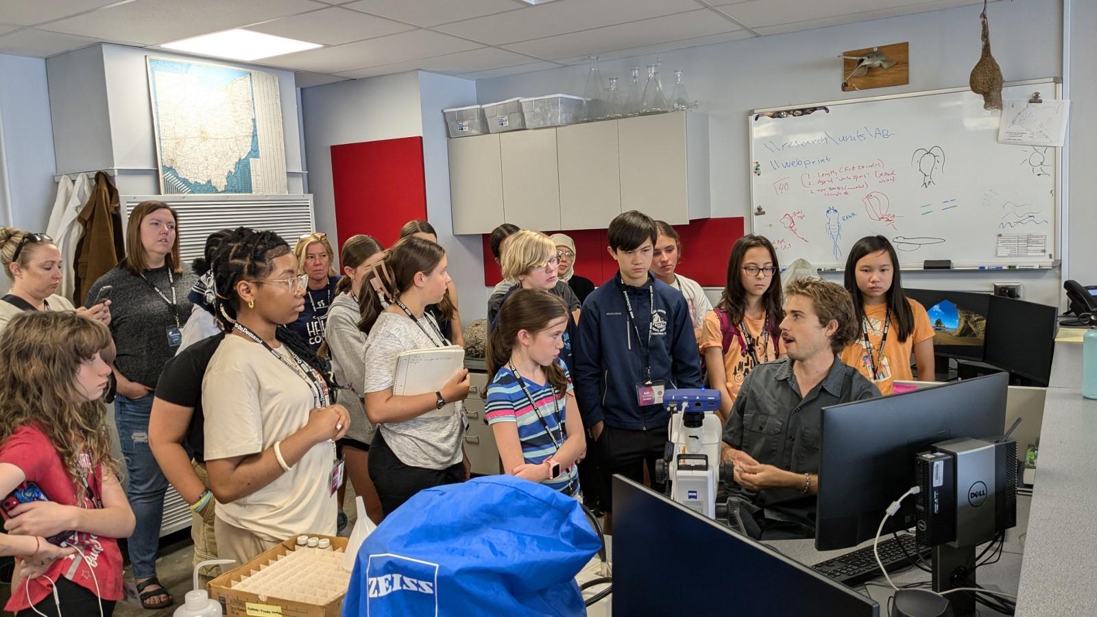 Neil Hamrick showing the students the gut contents of a Yellow Perch on his computer screen