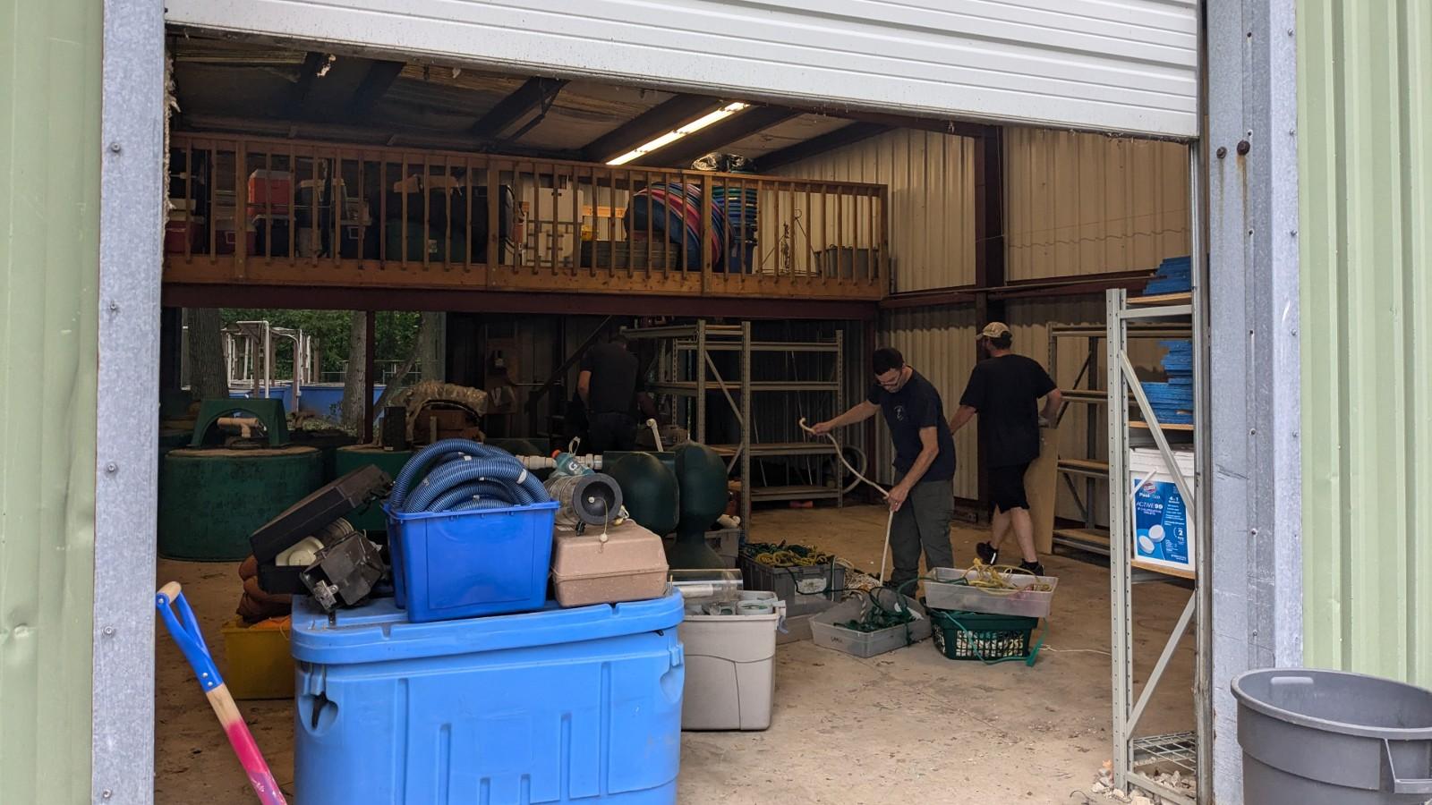 Crew cleaning out the barn