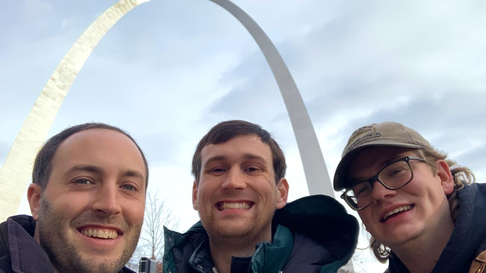 Steven Gratz, Andrew Foley, and Jacob Bentley in front of the St. Louis arch