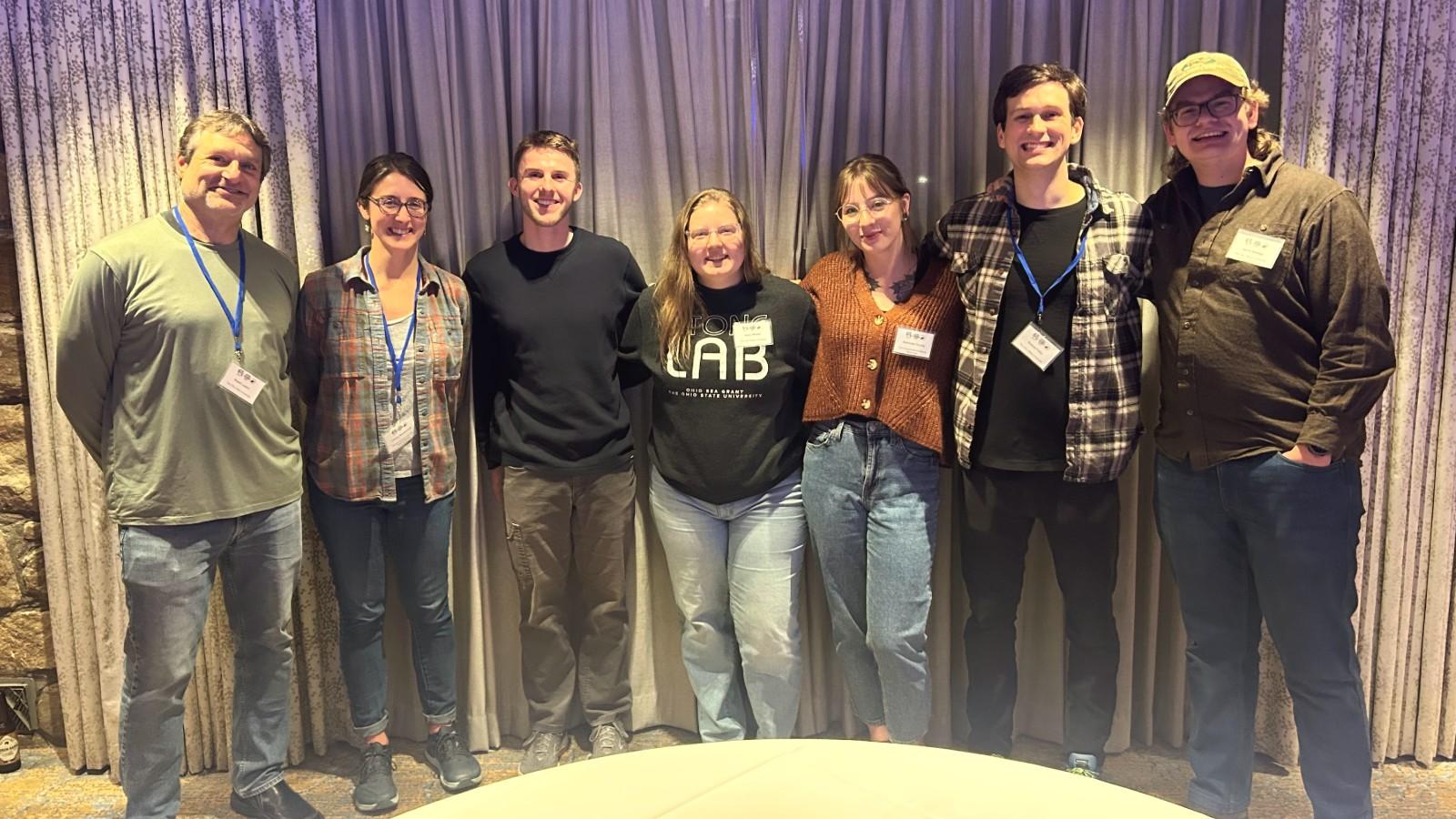 Group photo of AELers at the conference: Stu Ludsin, Lindsey Bruckerhoff, Justin Furby, Kylee Wilson, Sam Truckly, Andrew Foley, and Jacob Bentley