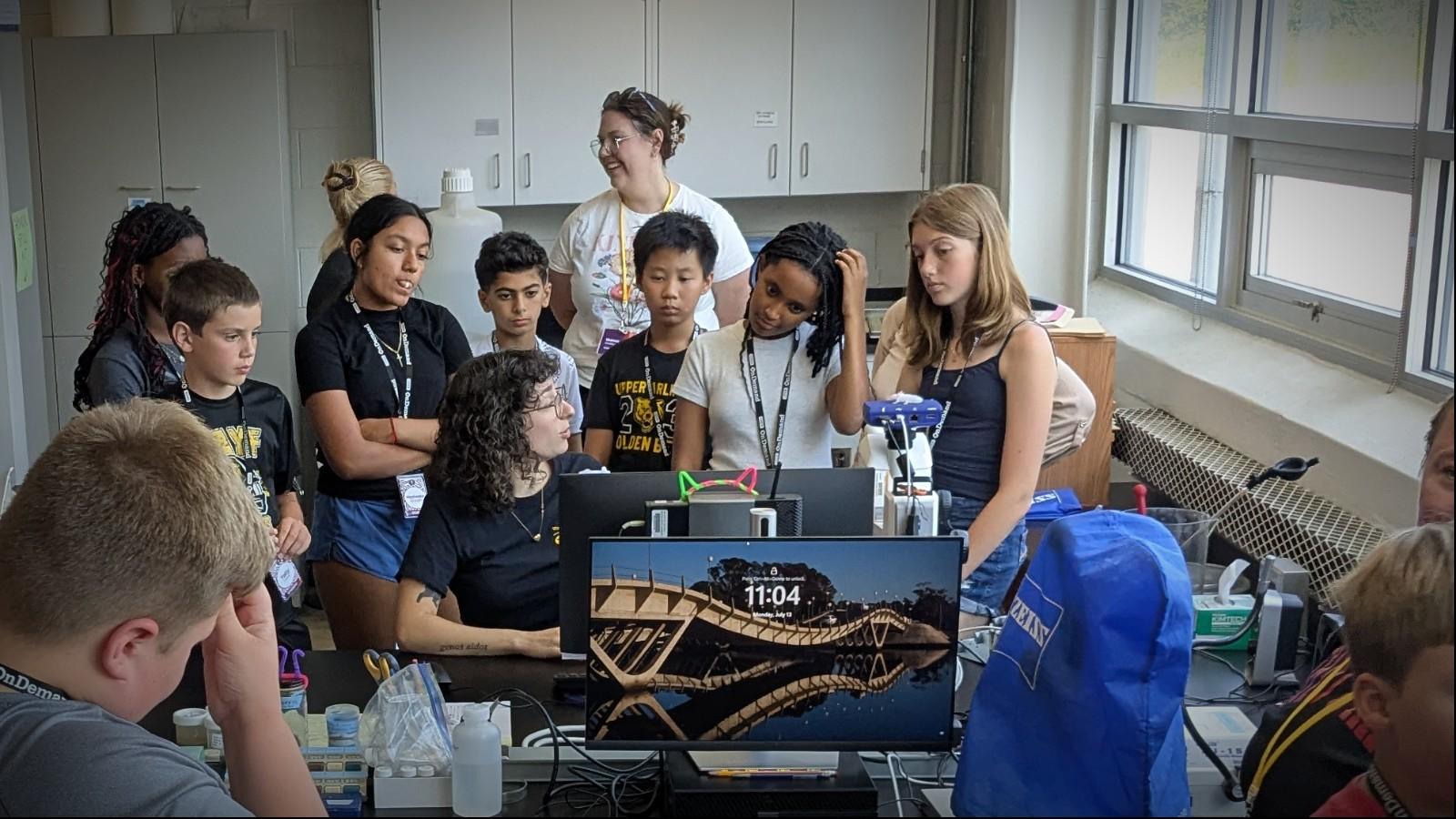 Haley Miller talking to students in the lab